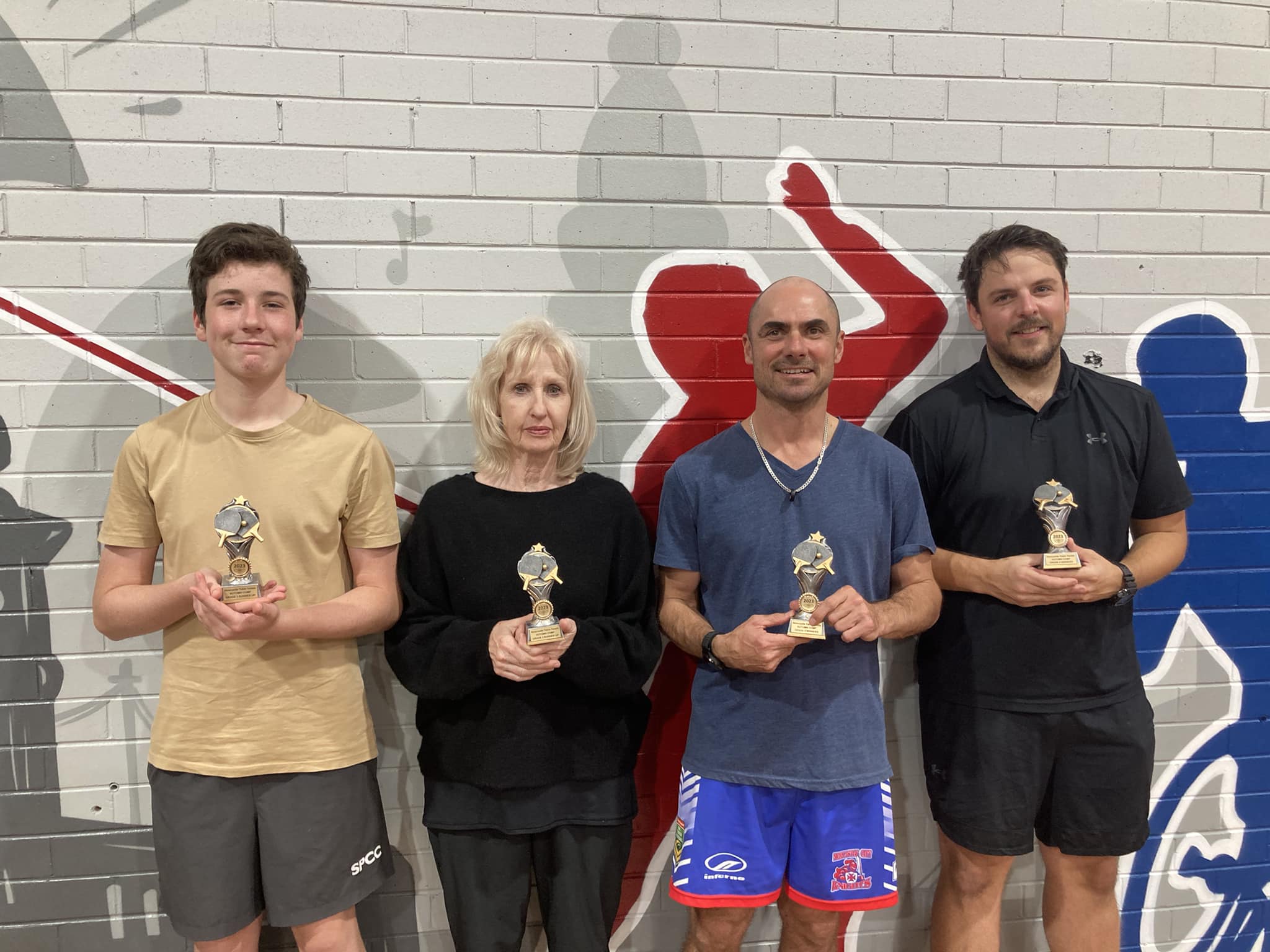 Newcastle Table Tennis Club players holding their trophies